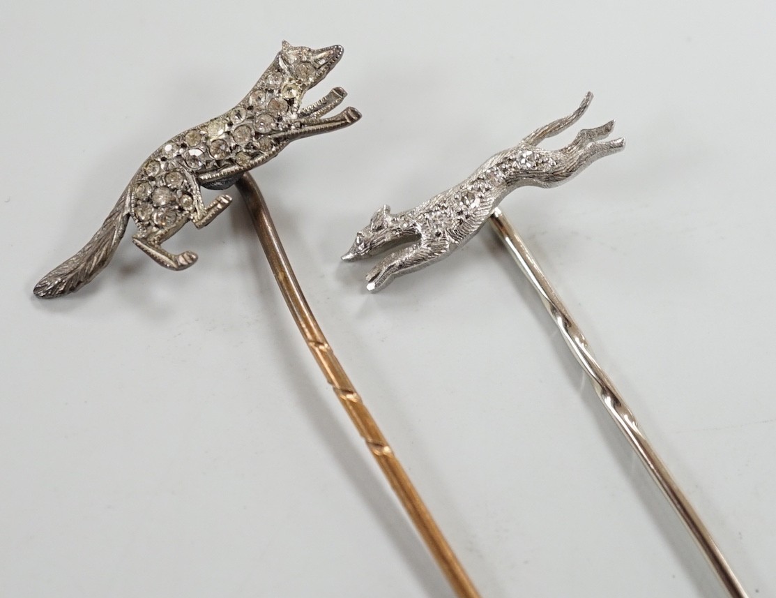 A mid 20th century white metal and diamond chip set hound stick pin, 57mm, in Asprey box and a similar paste set fox stick pin.